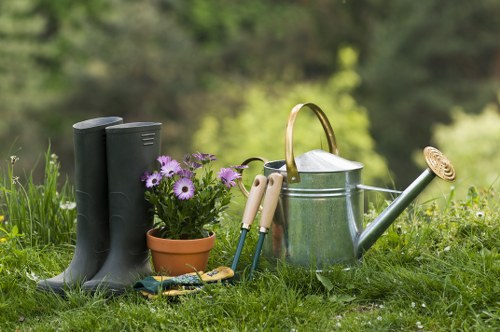 Gardener performing final checks on a landscaped area